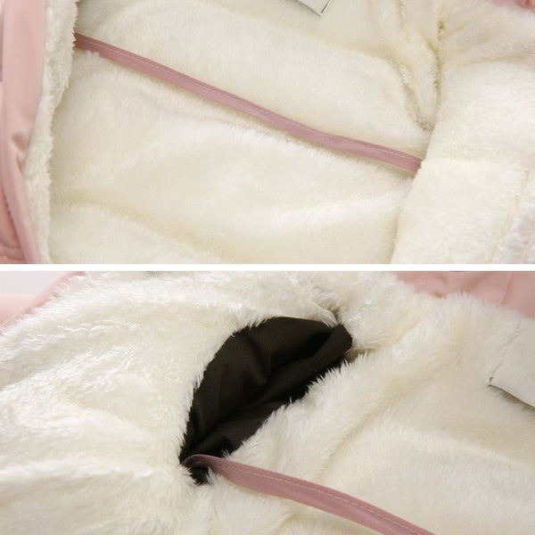 Intérieur en polaire douce et fermetures solides de la Combi Pilote Bébé rose.