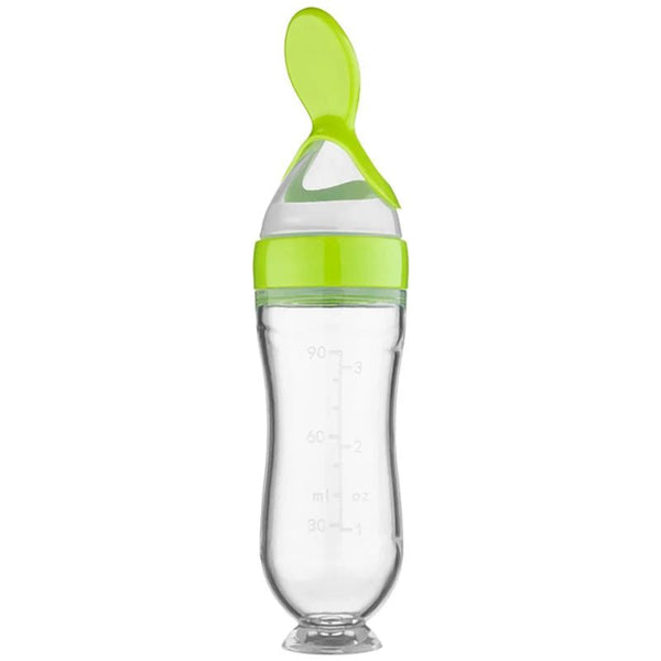 Biberon Cuillère vert avec couvercle en silicone pour repas propres.