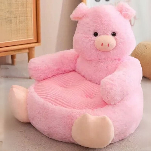Fauteuil Bébé Animaux cochon rose en peluche, vue seule dans une chambre