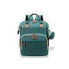 Sac à dos à langer vert, alliant style et praticité pour transporter tout le nécessaire de bébé.