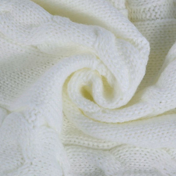 Zoom sur le tricot moelleux du Nid d'Ange Emmaillotage, idéal pour garder bébé au chaud.