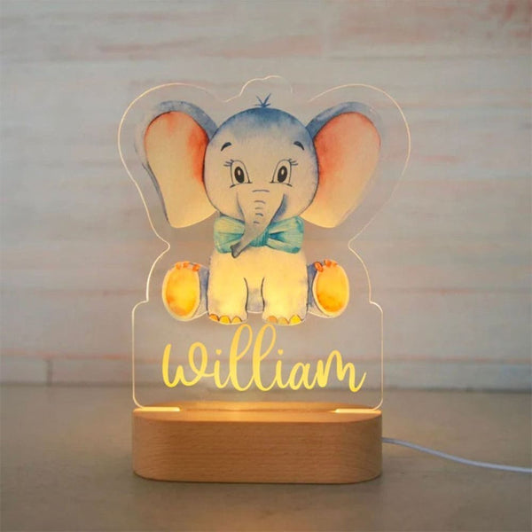 Veilleuse bébé personnalisée avec prénom "William", éléphant bleu, lumière douce et rassurante.