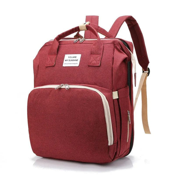 Sac à Dos à Langer rouge profond, idéal pour transporter les essentiels de bébé.