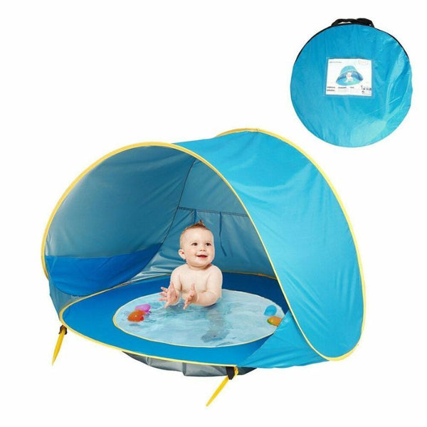 Tente de plage bébé bleu avec bassin intégré, sac de transport et accessoires inclus pour une installation rapide.