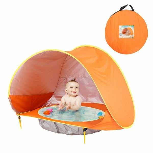 Tente de plage bébé orange avec bassin intégré, sac de transport et accessoires inclus pour une installation rapide.