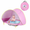 Tente de plage bébé rose avec bassin intégré, sac de transport et accessoires inclus pour une installation rapide.