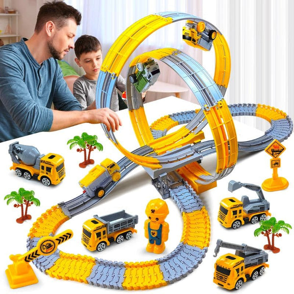 Enfant jouant avec un Circuit Looping monté avec son père - Camions de Chantier pour Enfants - Cocon d’Ange.