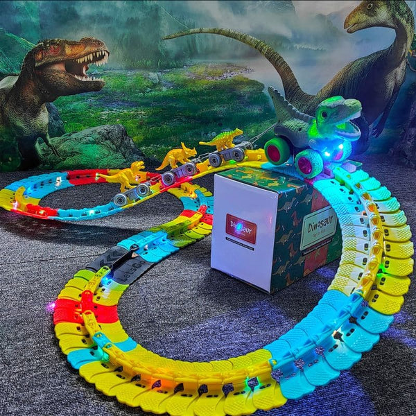 Circuit Voiture Dinosaure Suspendu avec pistes colorées et petits dinosaures devant une boîte à thème dinosaure - Cocon d'Ange.