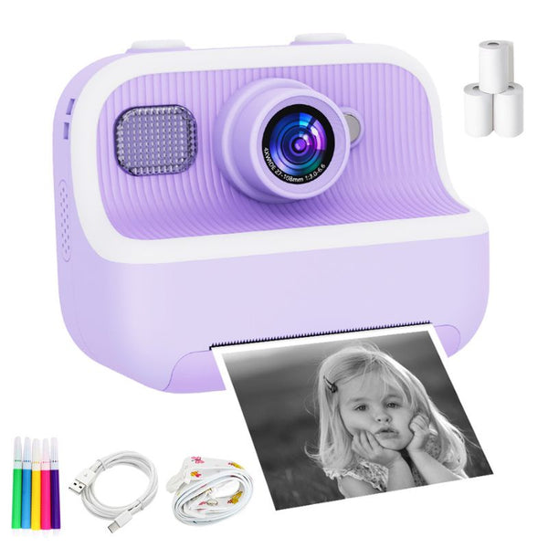 Appareil photo instantané violet avec une photo d'un enfant et des accessoires sur fond blanc - Appareil Photo Enfant Impression Instantanée Sans Encre
