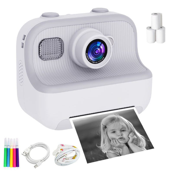 Appareil photo instantané blanc pour enfants avec une photo imprimée et des accessoires sur fond blanc - Appareil Photo Enfant Impression Instantanée Sans Encre