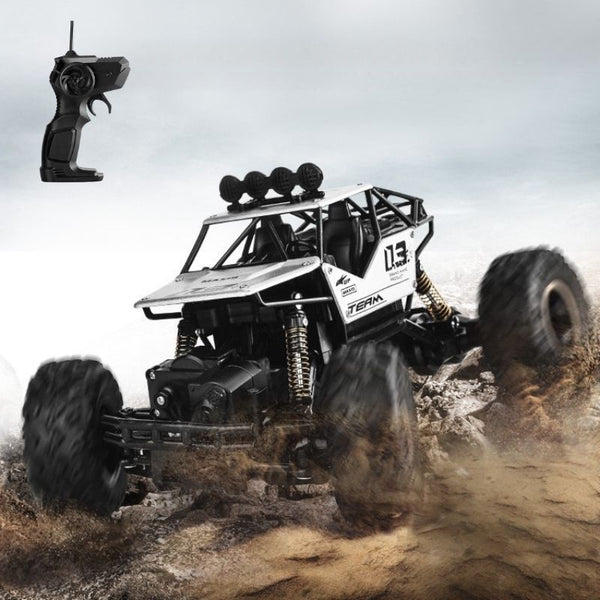 Buggy RC Télécommandé 4x4 Tout Terrain en action sur terrain rocailleux avec télécommande – Cocon d'Ange