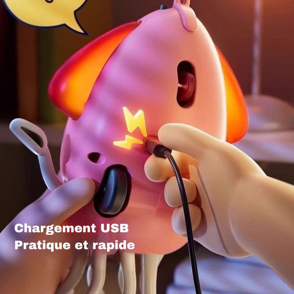 Appareil rose en forme de pieuvre en cours de chargement par câble USB, avec texte indiquant la recharge USB – Pieuvre Dansante