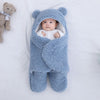 Nid d'ange bébé bleu en forme d'ourson.