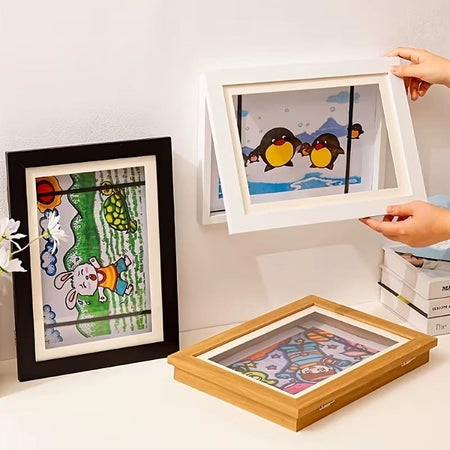 Trois cadres à dessins ArtFrame blanc, noir et effet bois posés, en affichage horizontal et vertical - Cocon d'Ange