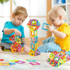Deux enfants assemblant des formes et structures avec le jeu de construction magnétique MagniMax - Cocon d'Ange