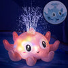 Pieuvre Octopus rose éclairée de LED colorées et son jet d'eau dans l'obscurité - Cocon d'Ange